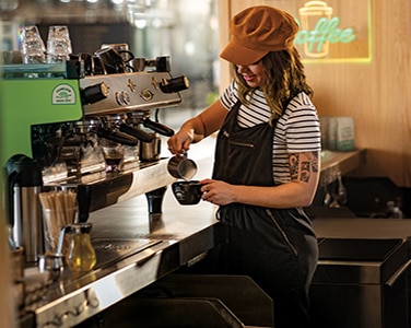 Barista pours handcrafted Chameleon coffee