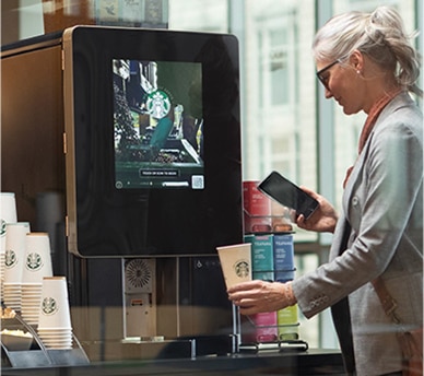 Woman Uses Touchless Starbucks Serenade Brewer in Apartment Common Area