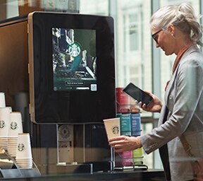 Woman Uses Touchless Starbucks Serenade Brewer in Apartment Common Area