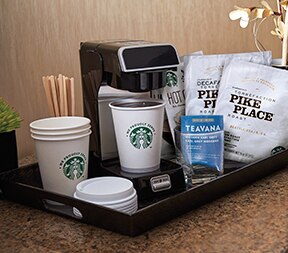 Starbucks Coffee Station in a Hotel Room With Starbucks Coffee Cups and Lids, Pike Place Coffee Bags,and Brewing Machine