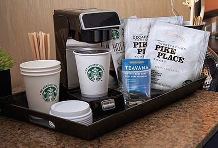 Starbucks Coffee Station in a Hotel Room With Starbucks Coffee Cups and Lids, Pike Place Coffee Bags,and Brewing Machine